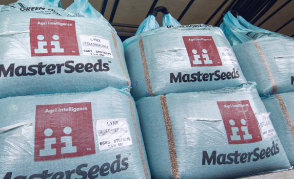 Stacked AgriiSeed blue bags on lorry awaiting delivery